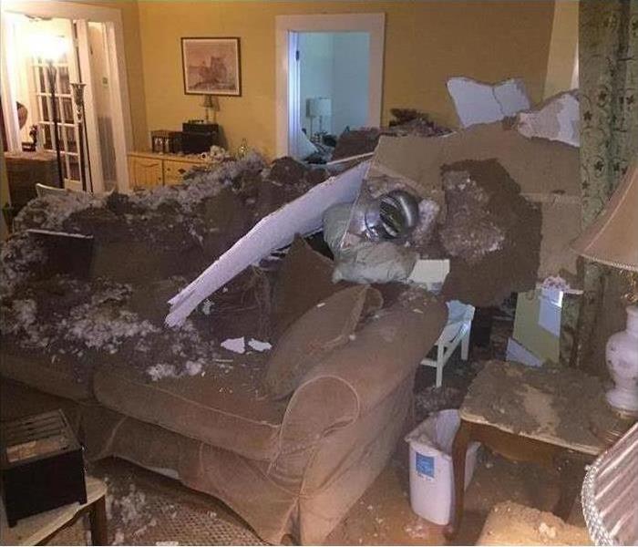 Debris in living room after a ceiling collapsed 